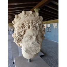 Marble portrait head of priest wearing laurel wreath